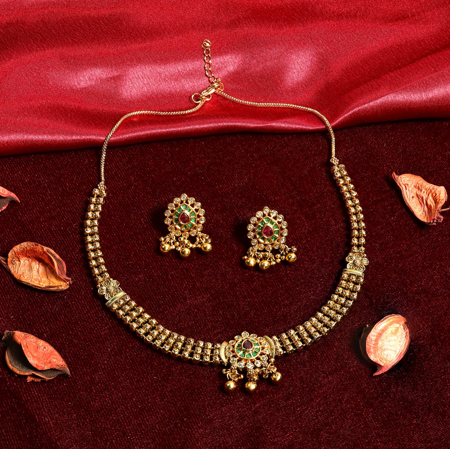 Gold Finish Kundan Necklace Set with Red Green Stones