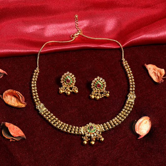 Gold Finish Kundan Necklace Set with Red Green Stones