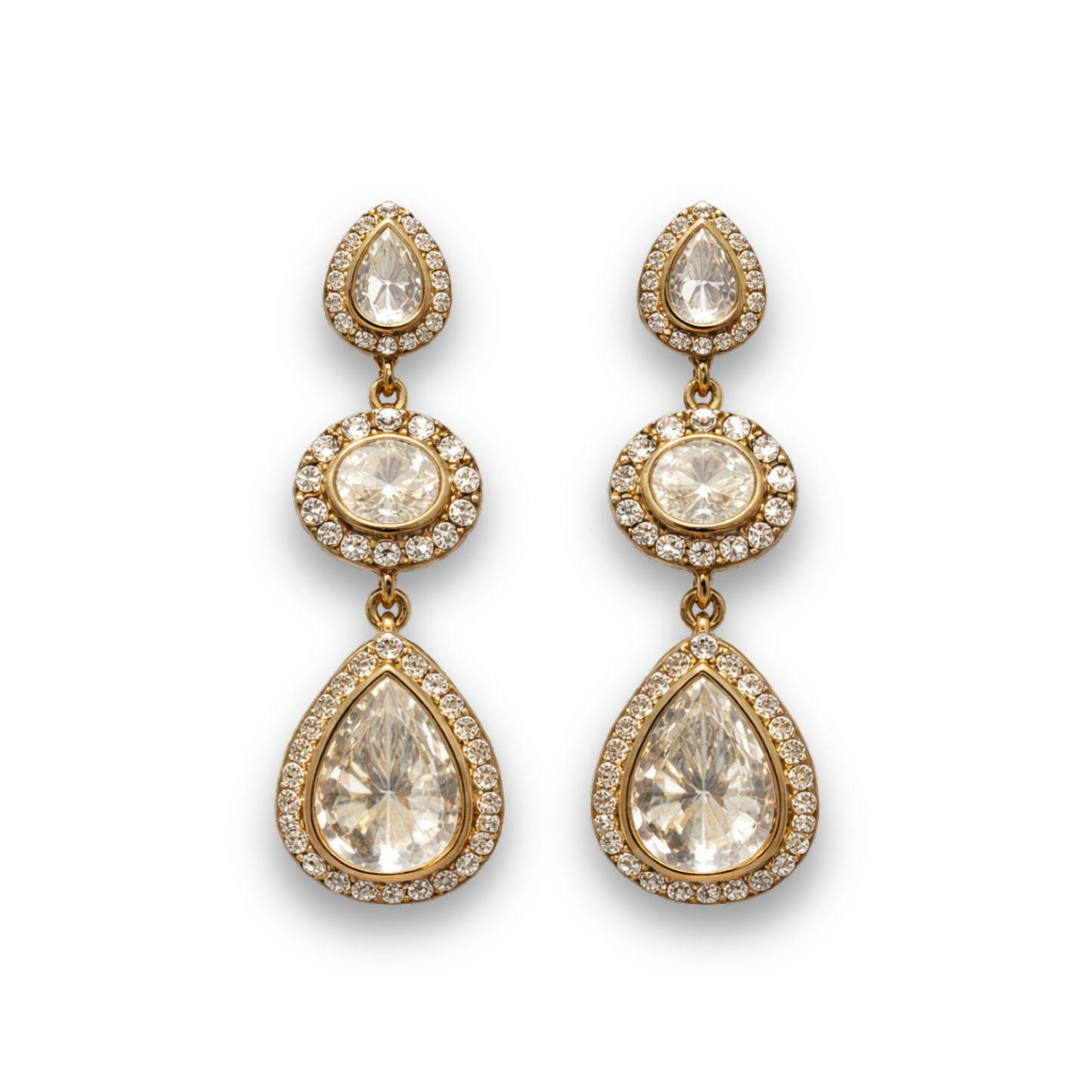 Gold teardrop earrings with clear gemstones on a white background